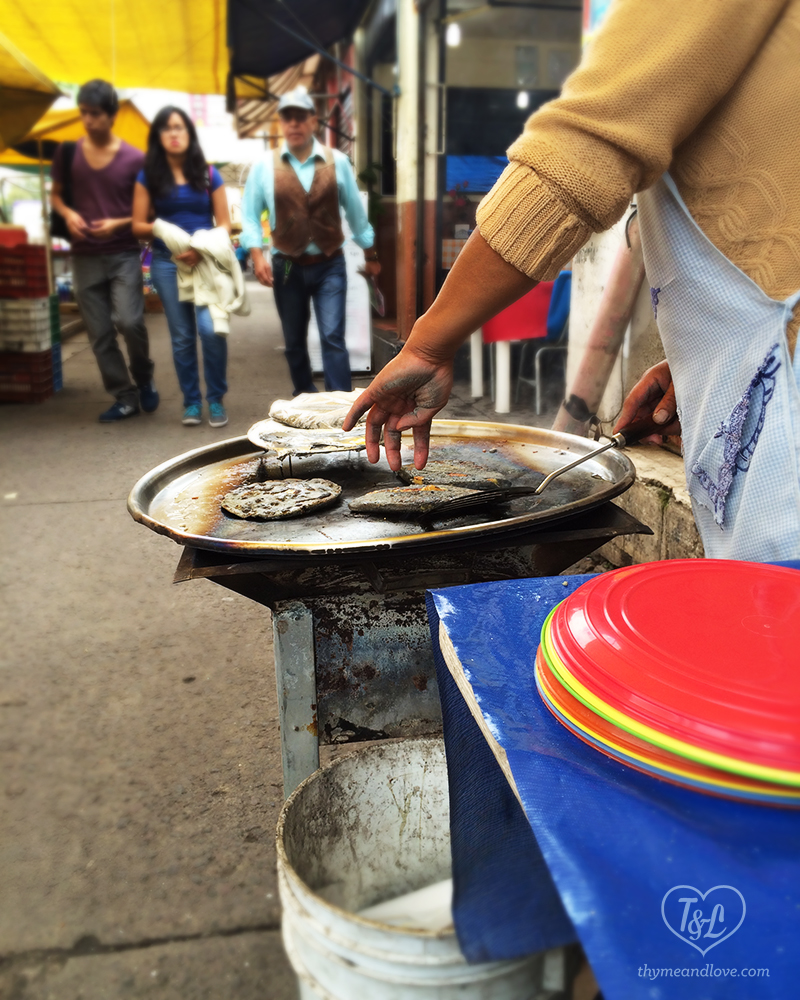 Tlacoyos- A popular Mexican Street Food. Blue Corn Masa filled with Haba beans, refried beans,, or queso. A great snack option while eating in Mexico City! 