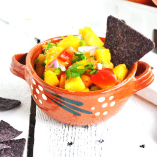 Light and refreshing Fresh Peach Salsa is perfect with chips or on taco night!