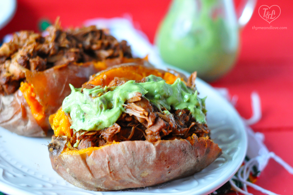 Slow Cooker BBQ Jackfruit served over baked sweet potatoes with an avocado crema. Easy and satisfying plant-based meal. #vegan #glutenfree #bbq