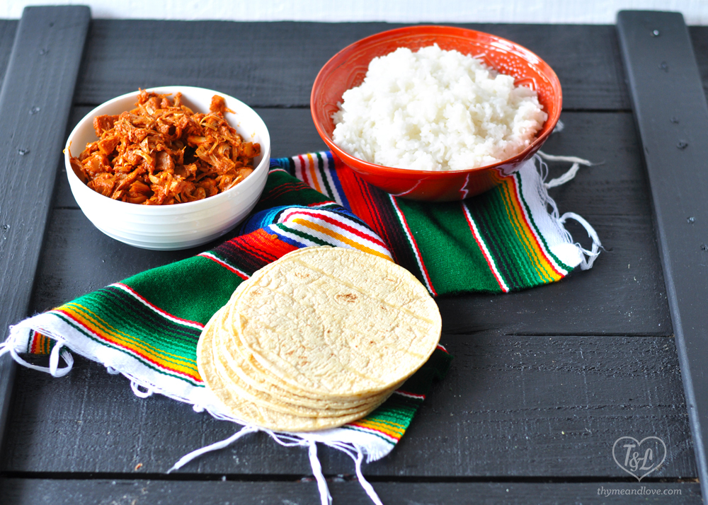 Jackfruit Tacos with Mexican White Rice are perfect for taco night! The jackfruit is packed full of flavor from a red chile sauce. #tacos #mexican #vegan #rice #veganmexican 