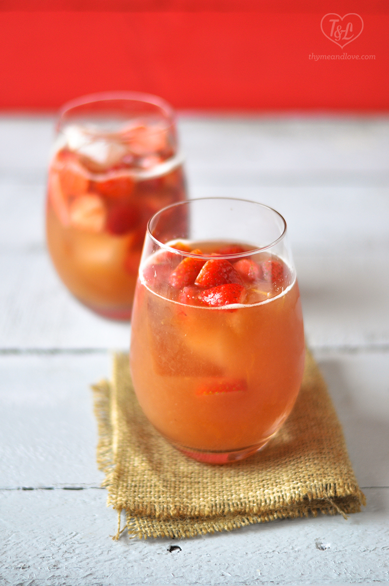 Fun, summery Strawberry Rhubarb Rose Sangria is perfect for your BBQs, Picnics, and potlucks! #sangria #summer #drink 