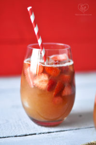 A fun, fruity drink perfect for summer. Make this Strawberry Rhubarb Rose Sangria for your next summer BBQ! #summer #bbq #drink #sangria