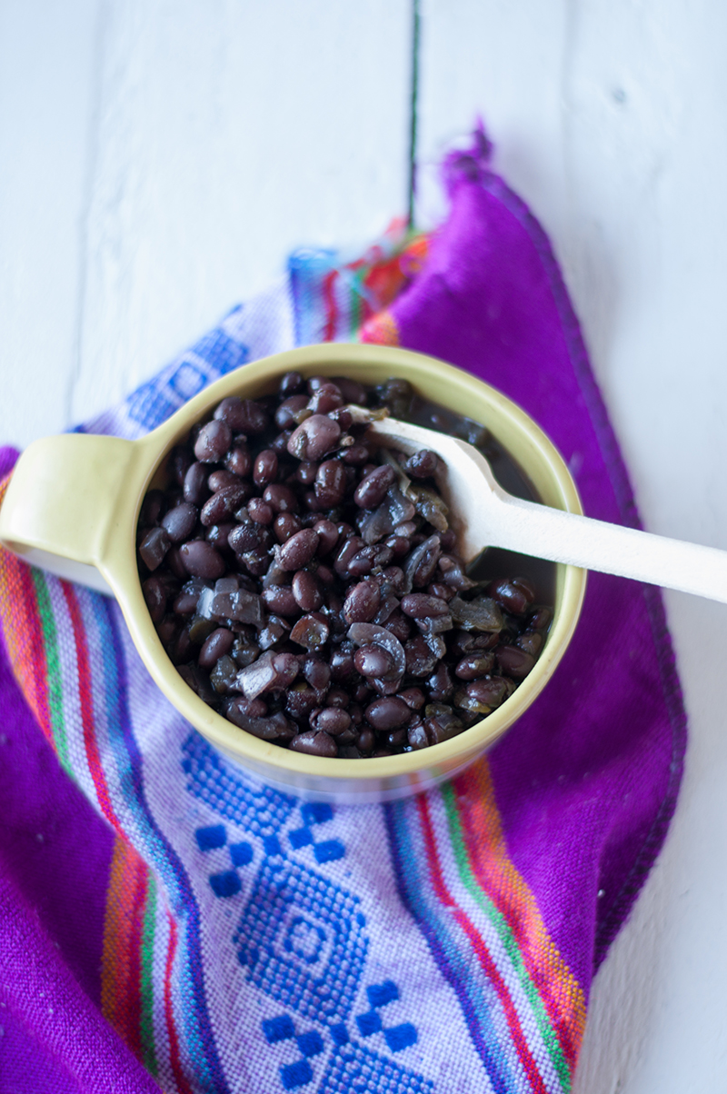 Easy Slow Cooker Black Beans with a Latin twist. Make a batch of beans on the weekend to enjoy throughout the week! #beans #latin #slowcooker