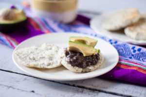 Chia Seed Arepas with beans and avocado are perfect any time of day! A protein packed plant-based meal! #vegan #glutenfree