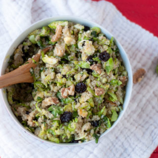 Vegan + GF Brussel Sprout Quinoa Salad with dried cherries. Perfect for meal prepping! #salad #mealprep