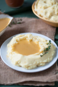 Vegan Mashed Potatoes with Apple Cider Gravy. Comforting, perfect mashed potatoes topped with an easy vegan gravy. #thanksgiving #vegan