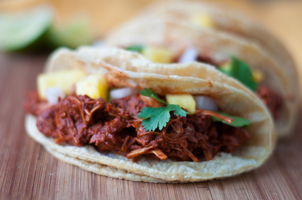 Jackfruit is slow cooked in a chile + citrus sauce with pineapple. Perfect for Taco Tuesday! 
