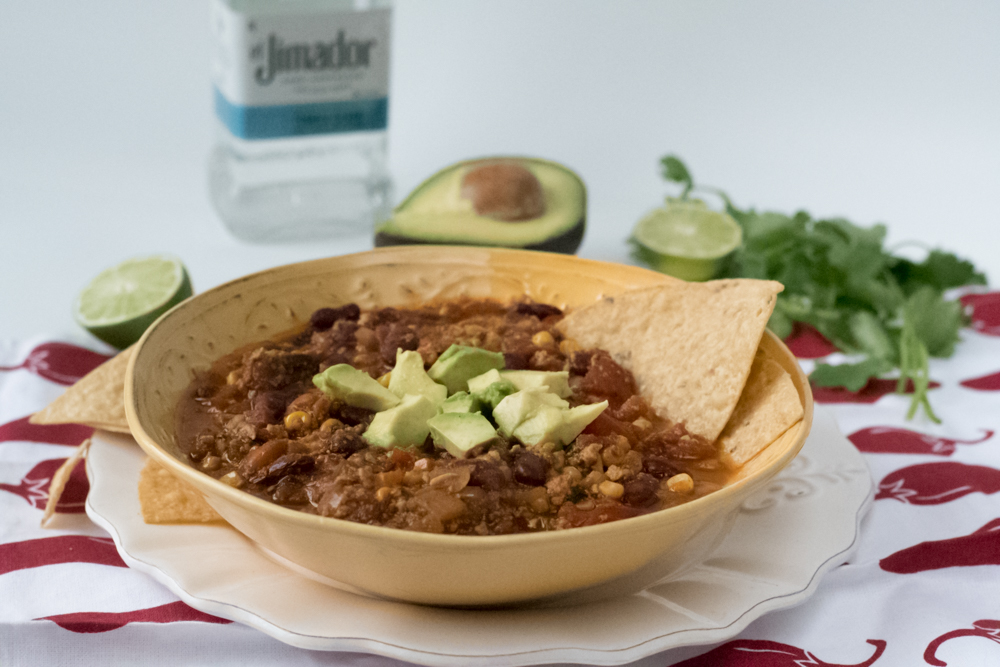 This Vegan Tofu Chili gets a kick from tequila. Perfect for game day! #chili #vegan