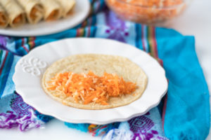 Corn tortillas are filled with a simple carrot and parsnip filling. Perfect for taco night!