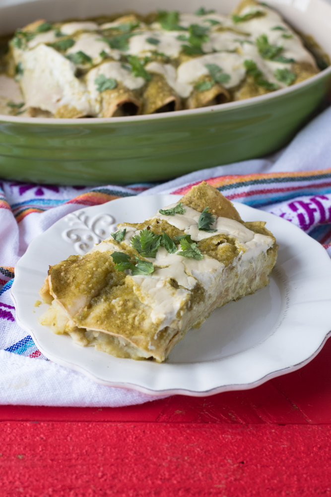 Potato and Roasted Poblano Enchiladas are a satisfying dinner option that everyone will love. Inspired by papas con rajas, these enchiladas have a spicy kick to them 