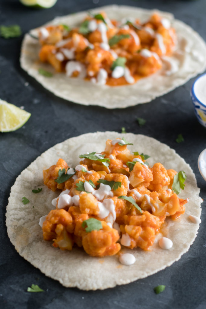 Spicy Cauliflower and White Bean Tacos are a quick & easy weeknight meal. They have a spicy kick from dried chiles!