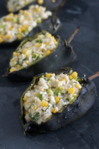 Roasted poblano peppers are stuffed with a creamy, rice filling. I like to serve these with an avocado and tomatillo salsa.
