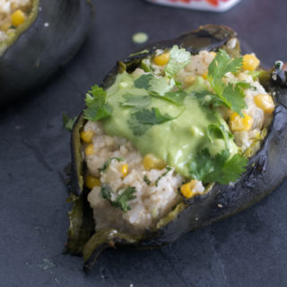 Roasted poblano peppers are stuffed with a creamy, rice filling. I like to serve these with an avocado and tomatillo salsa. #vegan #glutenfree