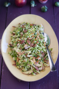 Brussel Sprout Apple Salad with coconut bacon is perfect for fall. The coconut bacon really takes this salad to the next level!