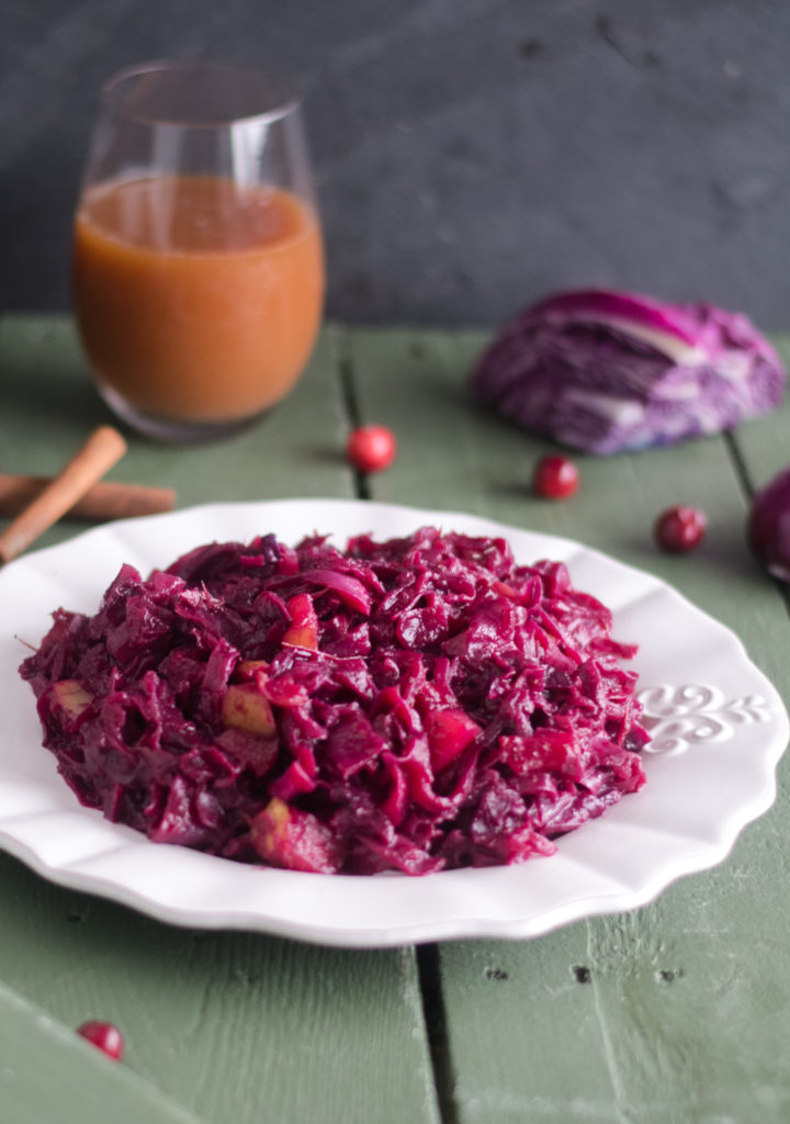 Add this festive Braised Red Cabbage with cranberries to your holiday table! #vegan #glutenfree