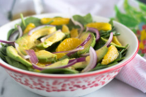 Start the new year off on a healthy note with this Spinach Orange and Avocado Salad with Guava Dressing! This salad is  light, refreshing and a perfect balance of flavors. #vegan #salad