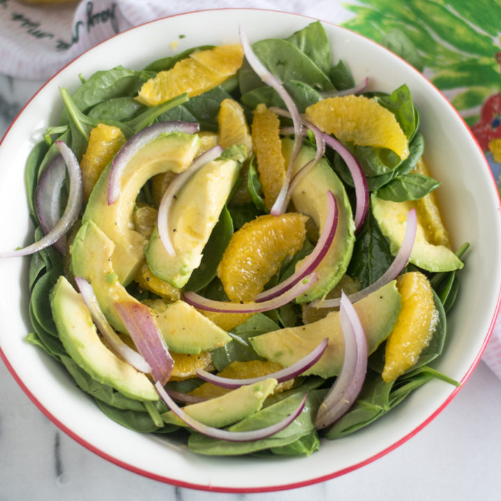 Light, refreshing Spinach Orange and Avocado Salad with a Guava Dressing. #vegan #salad #healthy