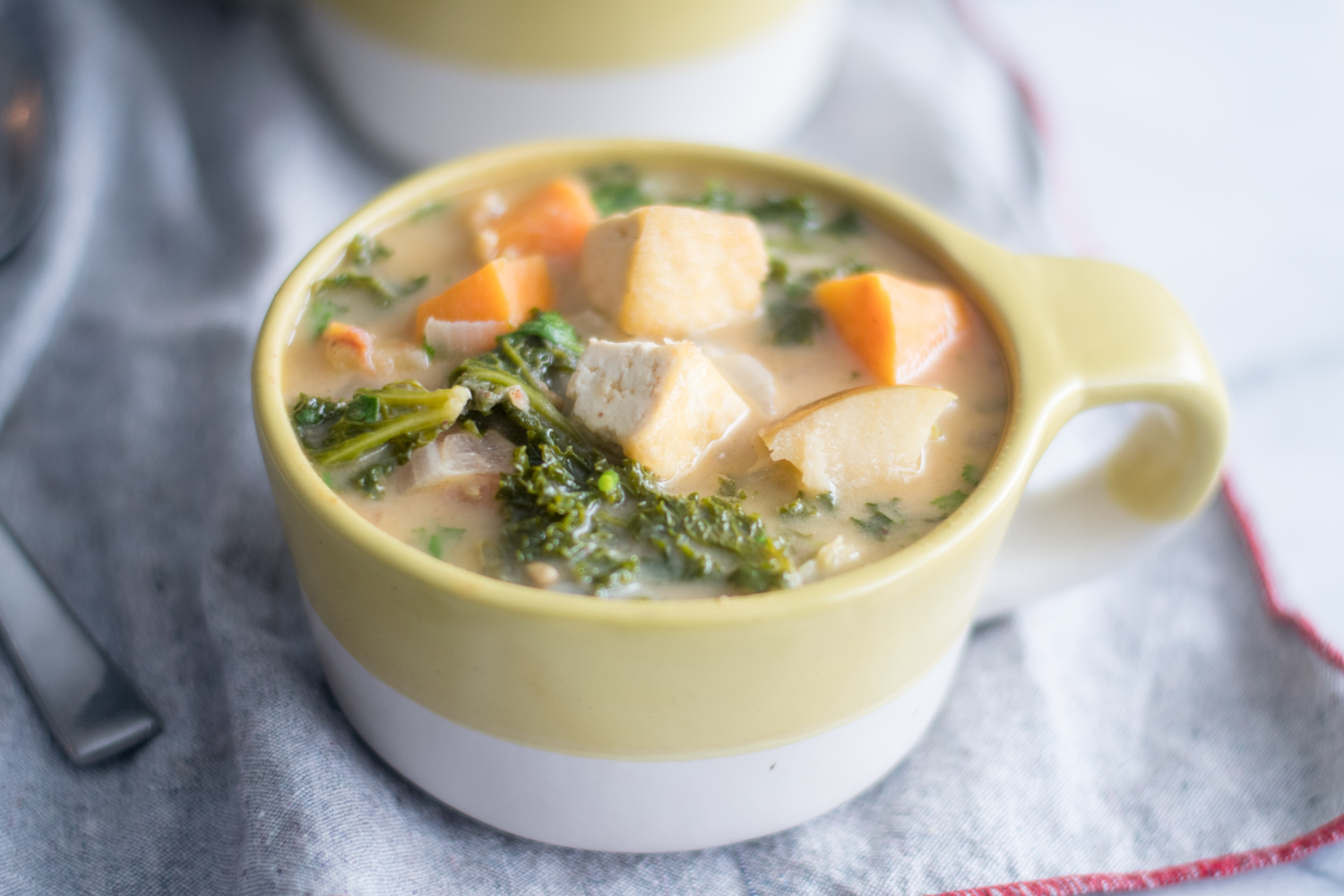 Tofu Sweet Potato and Almond Butter Stew with kale is a healthy and nutritious stew.  #vegan #stew