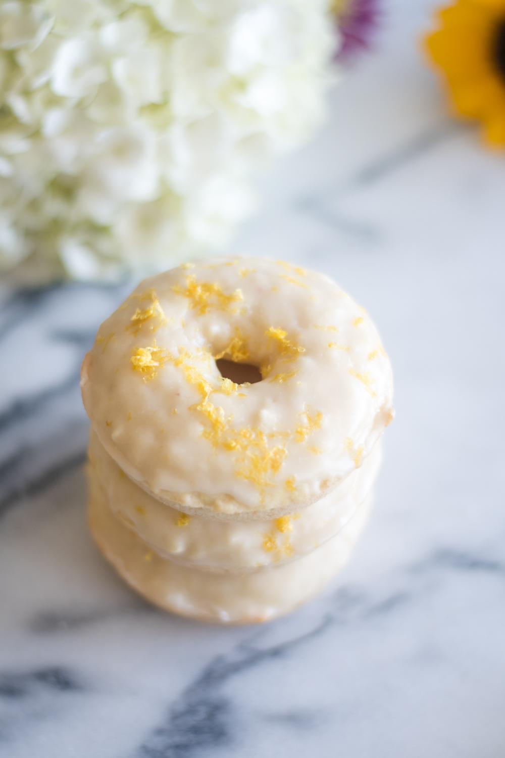 These baked vegan lemon donuts are perfect for spring. They are great for serving for breakfast, an afternoon treat or served at a springtime brunch!