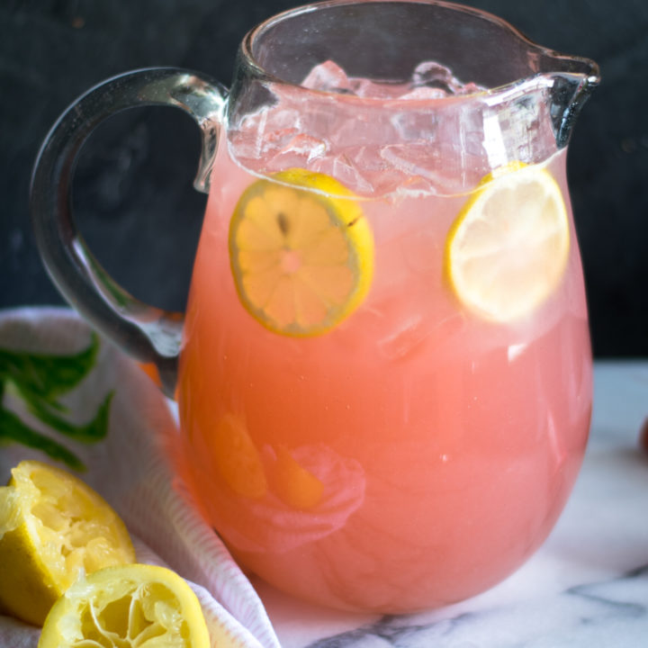 Light, refreshing lemonade made with rhubarb simple syrup. The perfect way too cool down on a hot summer day. #summer #recipe #rhubarb #lemonade #lemon #drink #vegan