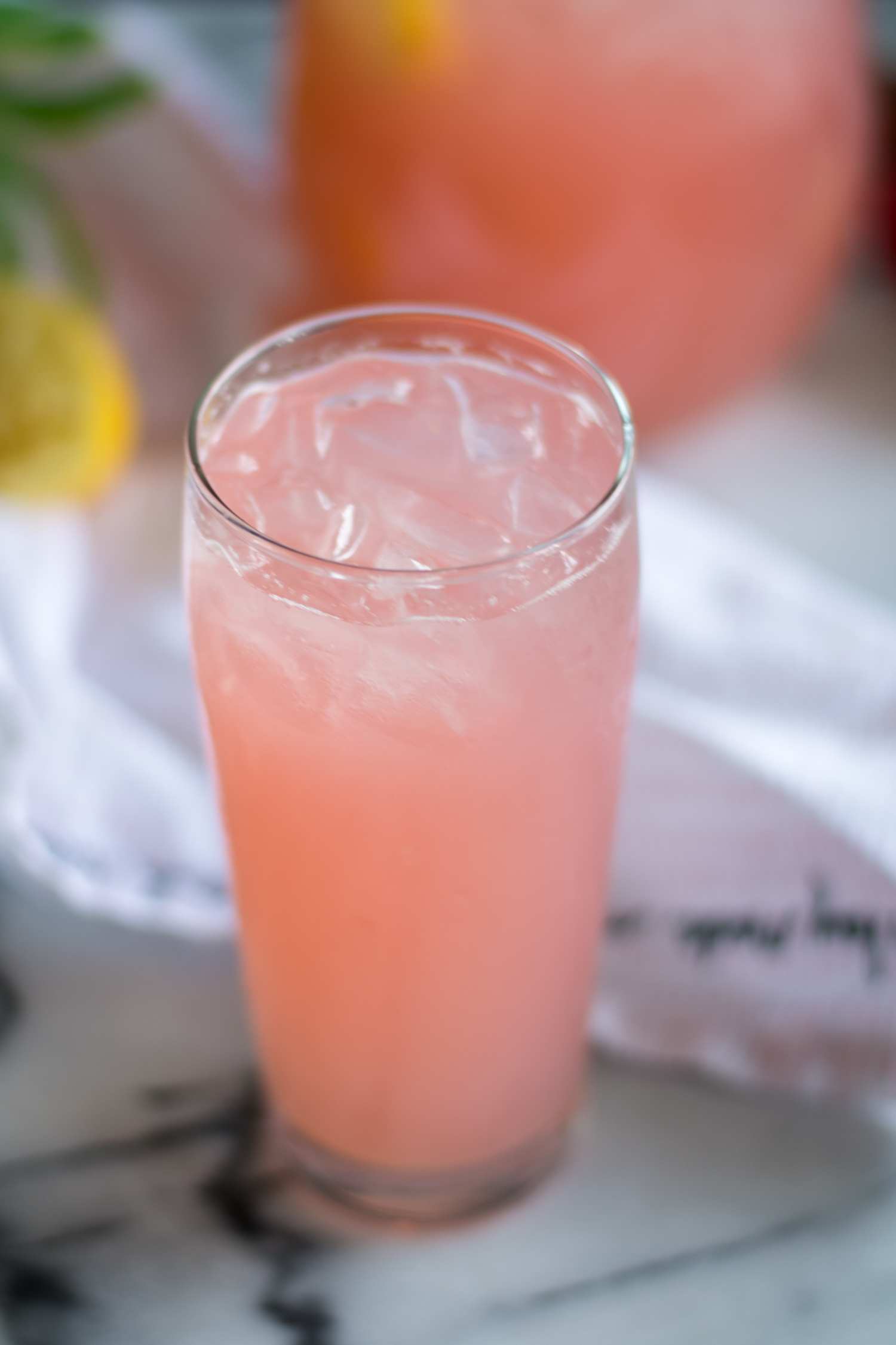 Light, refreshing lemonade made with rhubarb simple syrup. The perfect way too cool down on a hot summer day. #drink #recipe #vegan #summer #drink #rhubarb #lemonade #lemon 