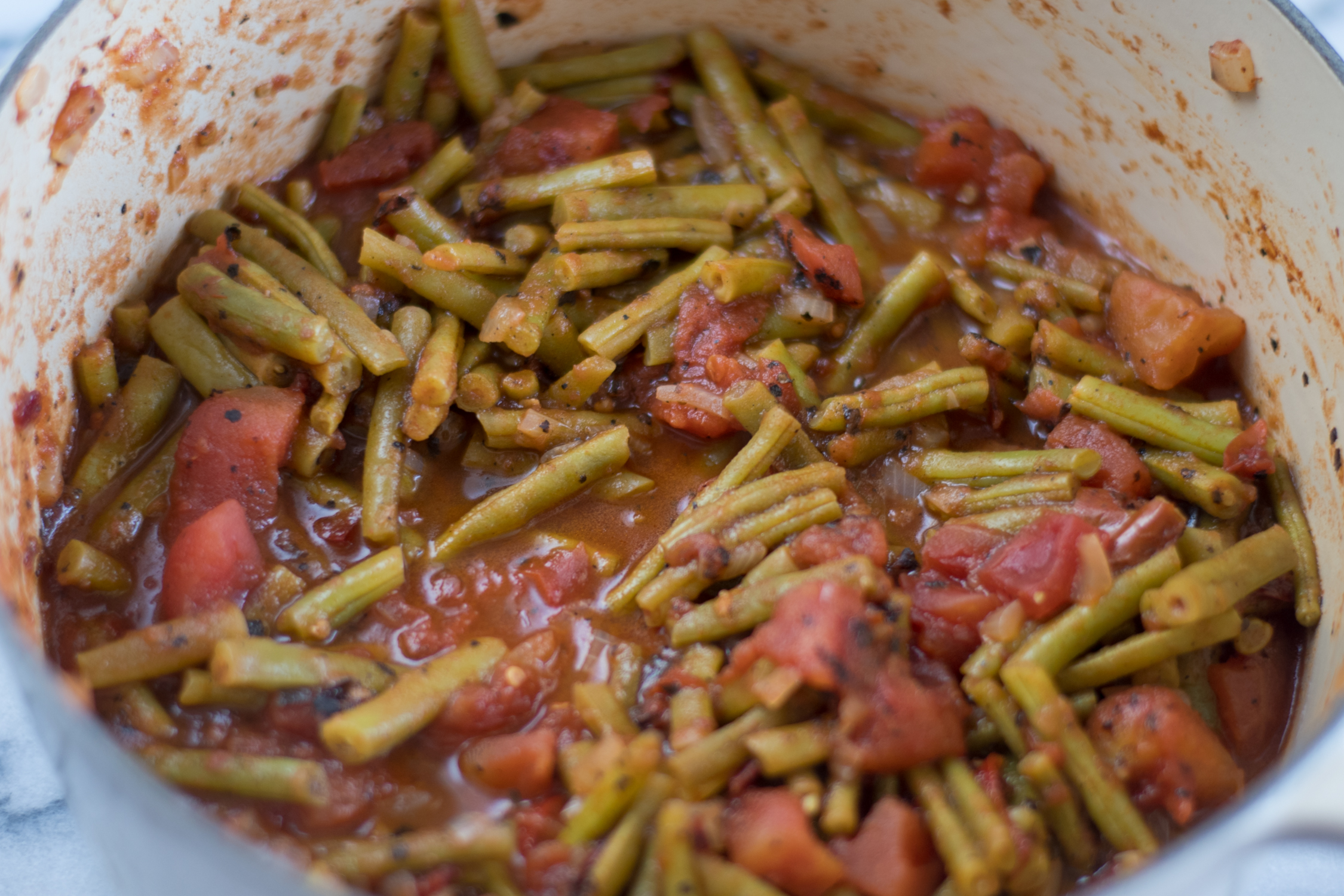 Green beans simmered with tomatoes.