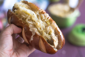 These Vegan dogs feature Field Roast's Smoked Apple and Sage Sausages are topped with an apple and sauerkraut topping!