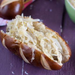 These Vegan dogs feature Field Roast's Smoked Apple and Sage Sausages are topped with an apple and sauerkraut topping! #vegan #vegandinner #easyrecipes #vegetarianrecipes #veganrecipes #apples