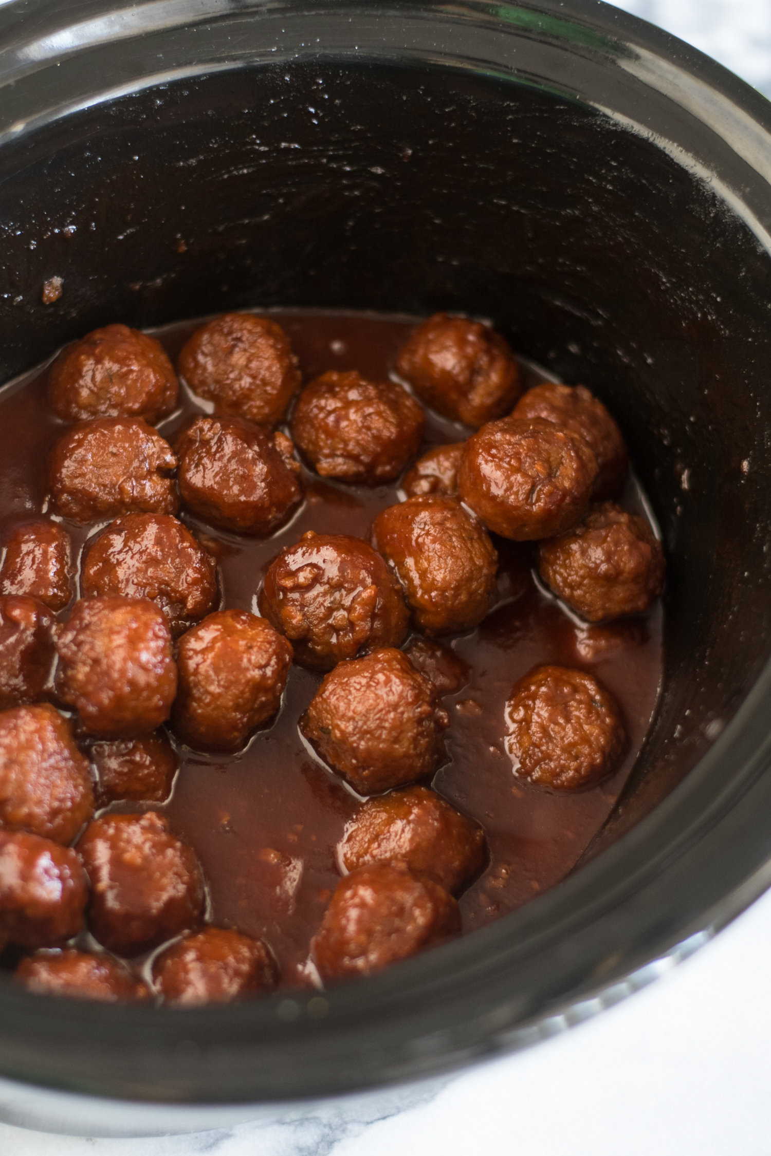 Slow Cooker Vegan Chili Sauce and Grape Jelly Meatballs are perfect for game day or holiday entertaining! #vegan #Christmas #Holidays #Recipes #Veganrecipes #vegetarian