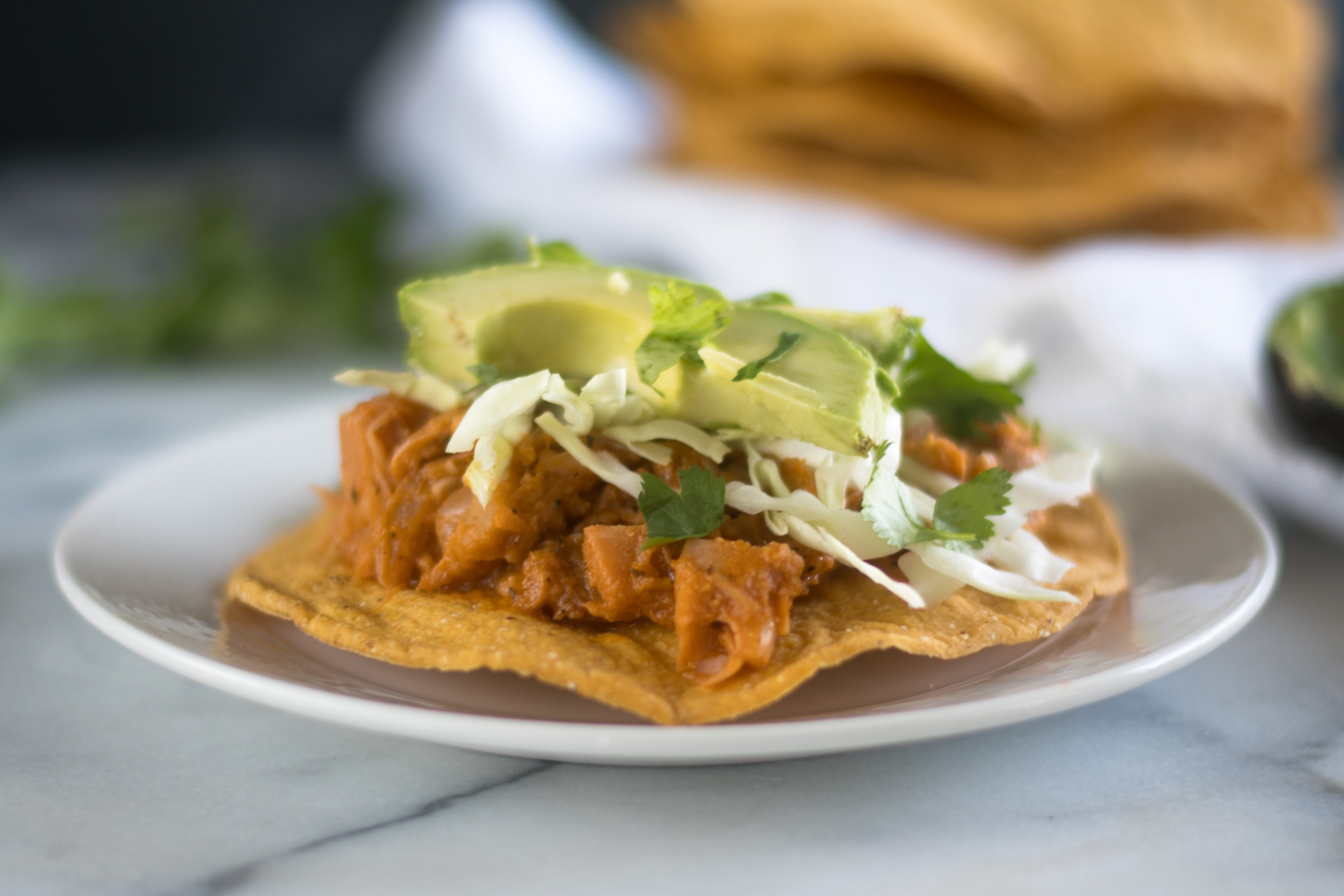 Jackfruit is simmered in a tomato and chipotle sauce in this vegan version of Mexican tinga. #Mexican #Vegan #Recipes 