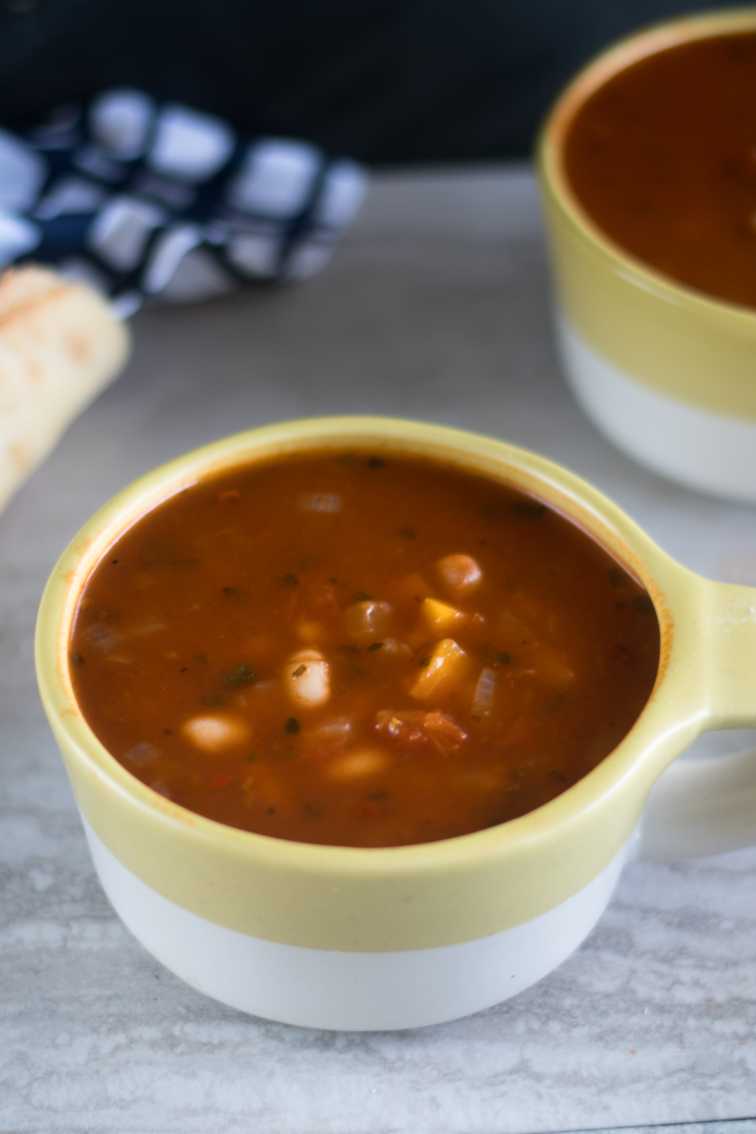 This Easy Tomato and White Bean Soup has a secret ingredient—marinara sauce! Use your favorite marinara sauce. The best part about this soup is that most of the ingredients are pantry staples.