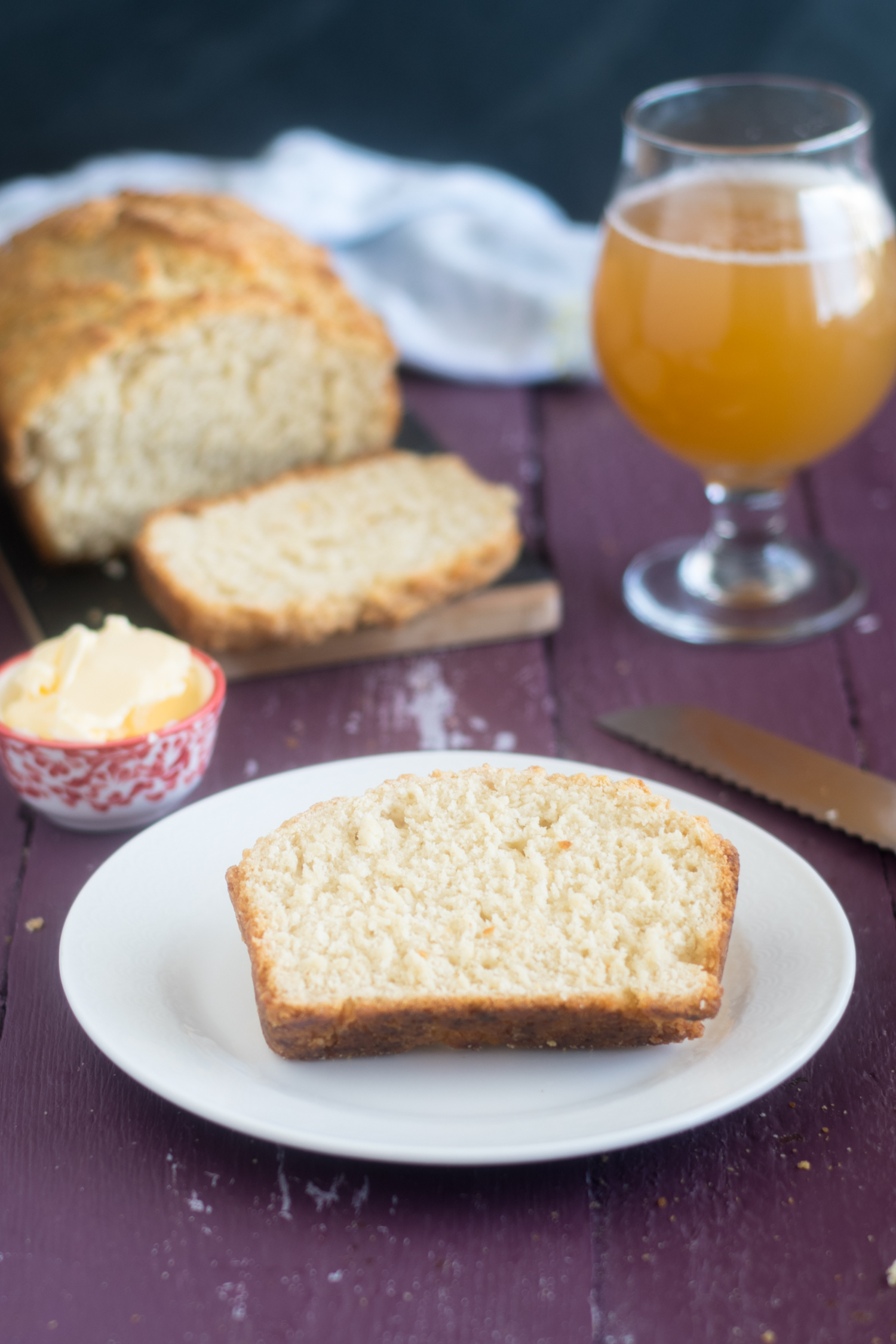 Homemade vegan beer bread topped with vegan butter. 