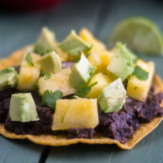 Black bean tostadas with pineapple salsa are perfect for a quick and easy meal. #vegan #recipe #easyrecipes #glutenfree #avocado #Mexican #vegetarian #healthy #healthyrecipes