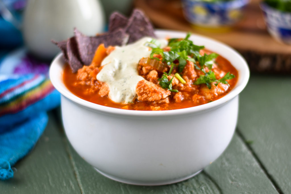 This Buffalo Tofu Chili is perfect for game day or for an easy weeknight dinner. This chili has the perfect balance of flavors and textures. It’s sure to be a crowd pleaser #chili #gameday #fall #vegan #tofu #recipes #vegetarian 
