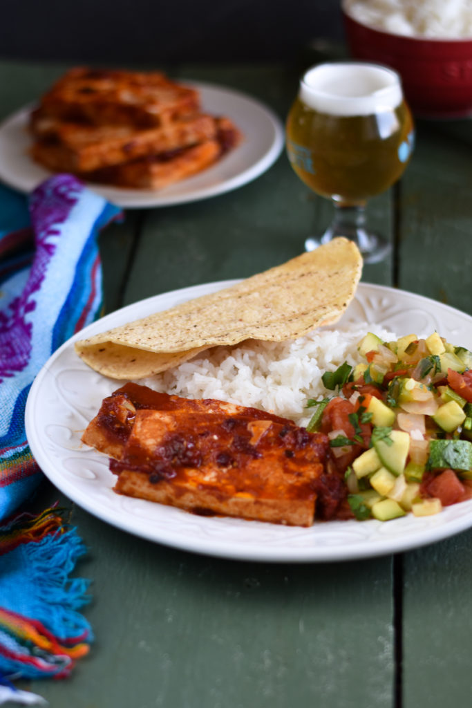 Looking to spice up basic tofu? Chipotles peppers add a spicy kick to plain tofu. Baked Chipotle Tofu is perfect for a main entree, used as a taco filling or on a sandwich!  #tofu #recipe #vegan #vegetarian #easyrecipes #plantbased #veganmexican #Mexican 