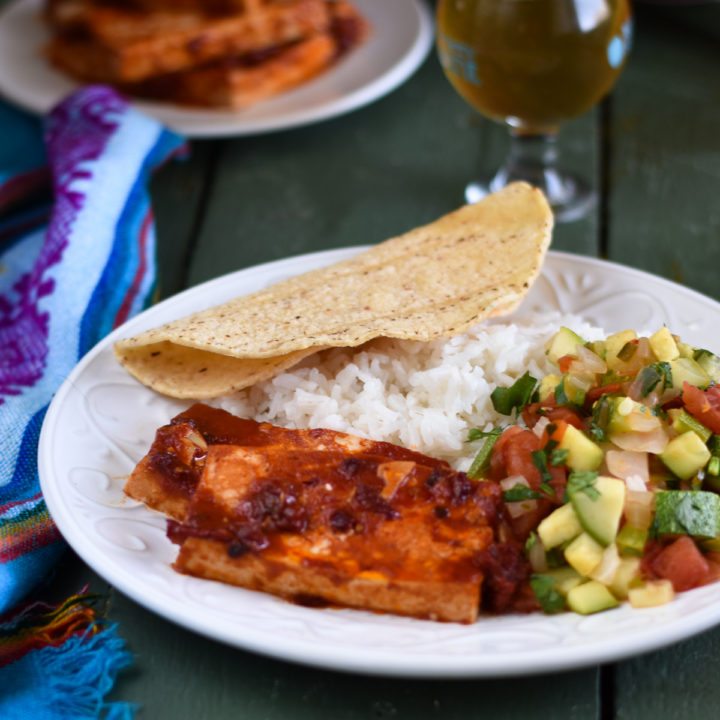 Looking to spice up basic tofu? Chipotles peppers add a spicy kick to plain tofu. Baked Chipotle Tofu is perfect for a main entree, used as a taco filling or on a sandwich! #tofu #recipe #vegan #vegetarian #easyrecipes #plantbased #veganmexican #Mexican