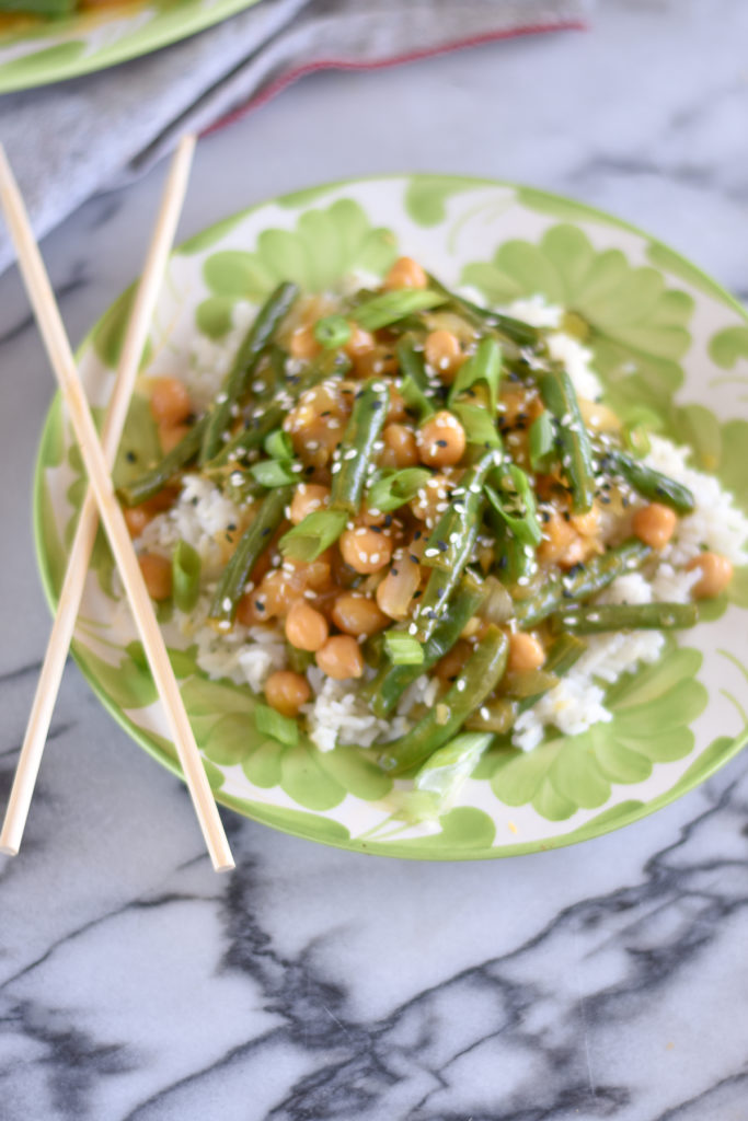 Green Bean Chickpea with Orange Sauce is a healthy, plant-based dinner entree. Skip the takeout and make this healthy stir fry at home! #vegan #recipes #greenbeans #healthy #food #recipes #vegetarian 