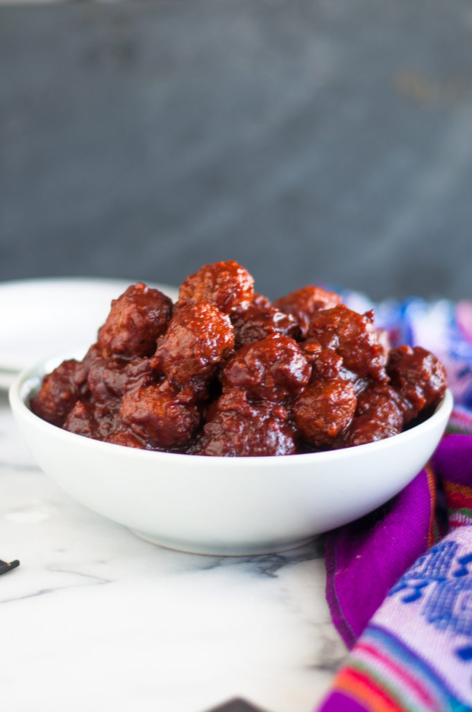 Slow Cooker BBQ Cranberry Vegan Meatballs are perfect for game day or holiday entertaining! #vegan #meatballs #slowcooker #crockpot #cranberry #bbq #easyrecipes #food #Christmas #holiday 