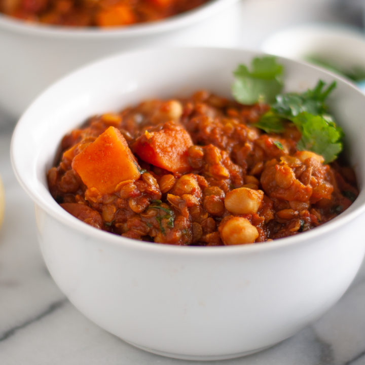 x Sweet Potato Lentil and Chickpea Stew with warming spices is a protein packed stew perfect on a chilly night. It is packed full of plant-based protein and budget-friendly! #vegan #recipes #food #dinner #entree #stew #sweetpotato #chickpeas