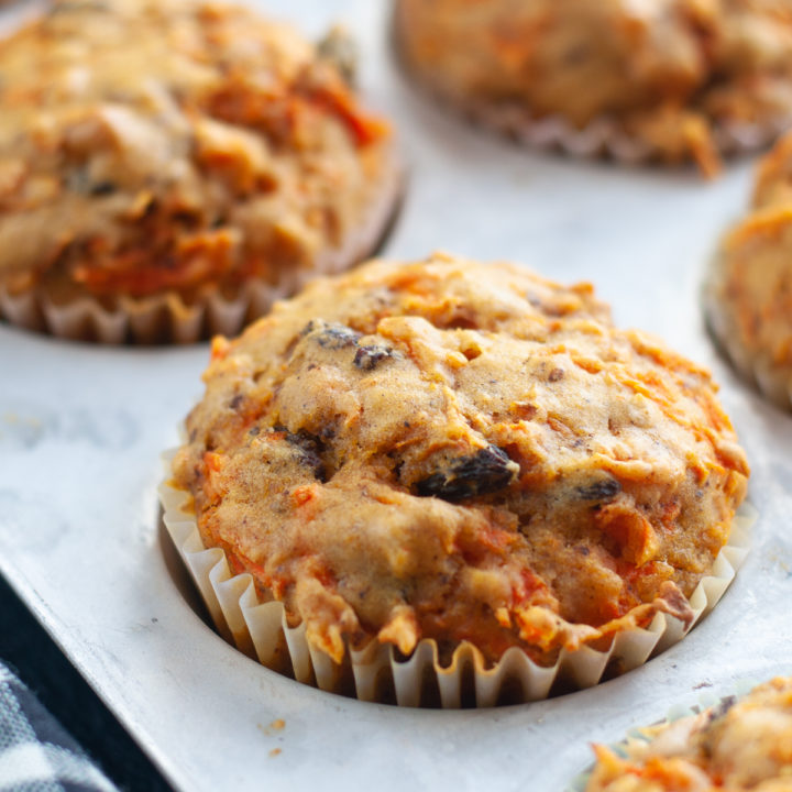 Muffins are a great way to start the morning! These muffins are loaded with carrots, raisins and walnuts! #muffins #breakfast #recipe #carrots