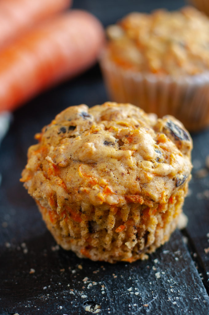 muffins are loaded with shredded carrots, raisins and walnuts add nutty crunch.  Perfect served alongside your morning coffee. #vegan #muffin #breakfast #recipe #carrot #spring #easter 