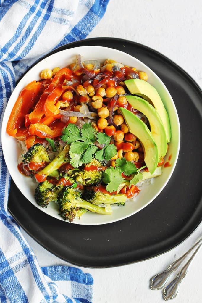 Easy bbq chickpea veggie rice bowl recipe! This vegan veggie power bowl is loaded with bbq chickpeas and veggies and comes together with just a few minutes of prep time.