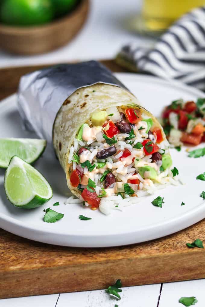 The Ultimate Vegan Burrito – the perfect meatless meal! Loaded with chipotle black beans, cilantro-lime rice, pico de gallo, avocado, and spicy sauce. They are packed with flavor and will be on your table in no time!