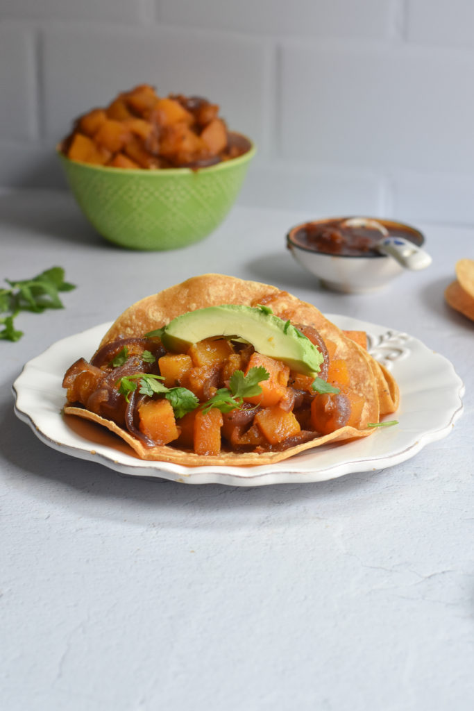 Braised Butternut Squash Tacos are a hearty, filling plant-based taco that is perfect for taco night. #vegan #taco #VeganMexican #dinner #recipe #glutenfree 