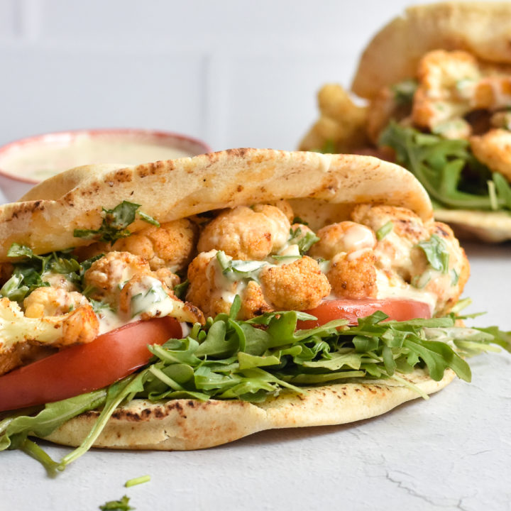 You're going to love easy it is to make this healthy, delicious recipe for Roasted Cauliflower Pitas with garlic lemon tahini sauce.