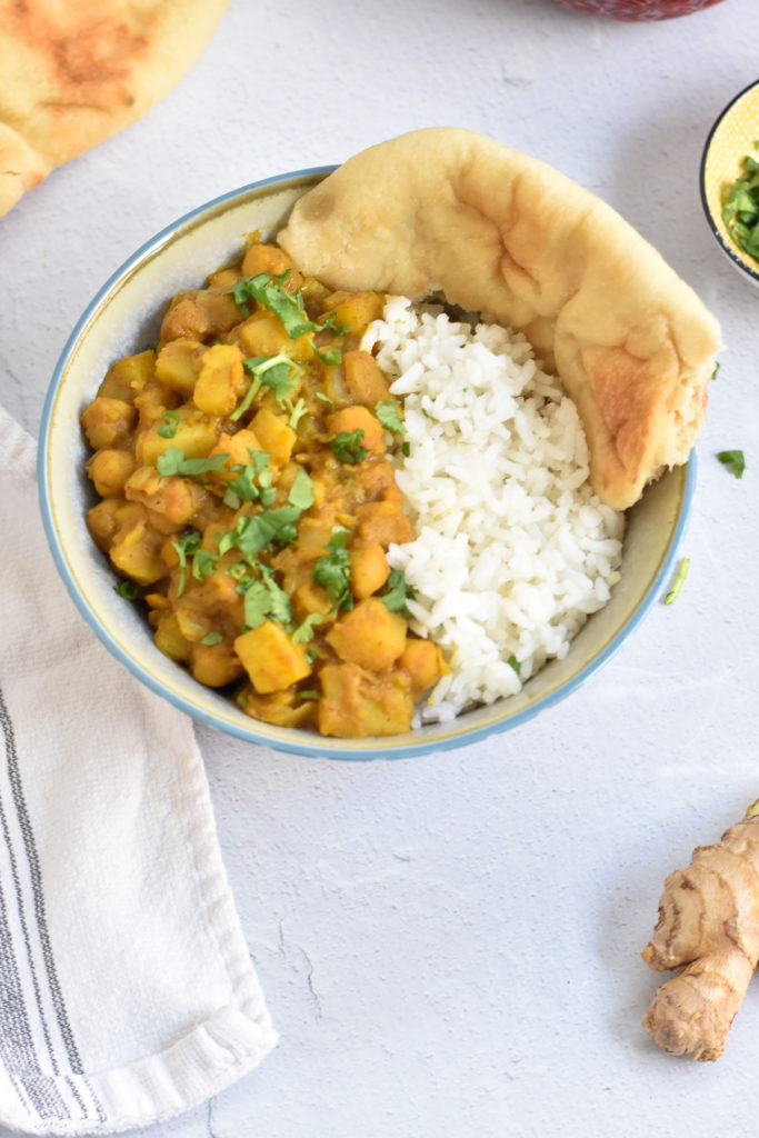 This recipe for Potato Chickpea Curry with mango chutney is a quick and easy plant-based curry recipe. Serve with white rice and naan bread. 