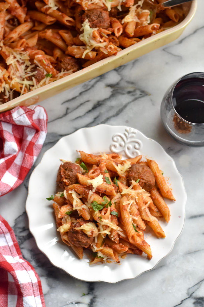 Vegan baked pasta with meatballs is delicious serve with a glass of wine and fresh baked bread.