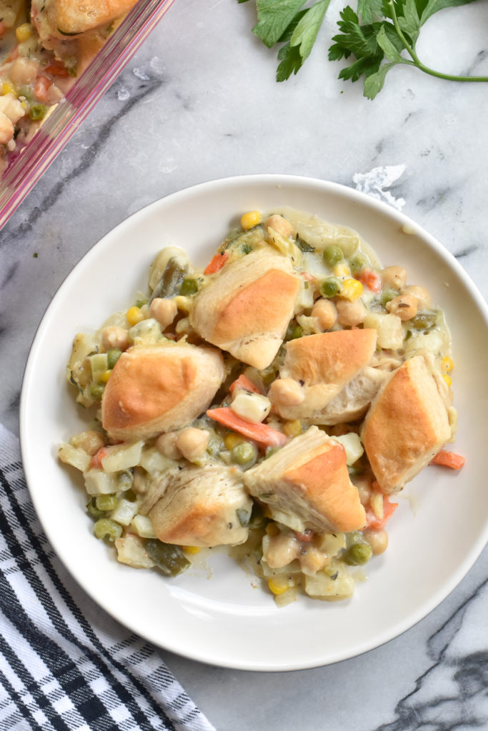 Easy, comforting Biscuit Veggie Pot Pie is my spin on a classic pot pie. Canned biscuits make this casserole and easy dinner recipe!