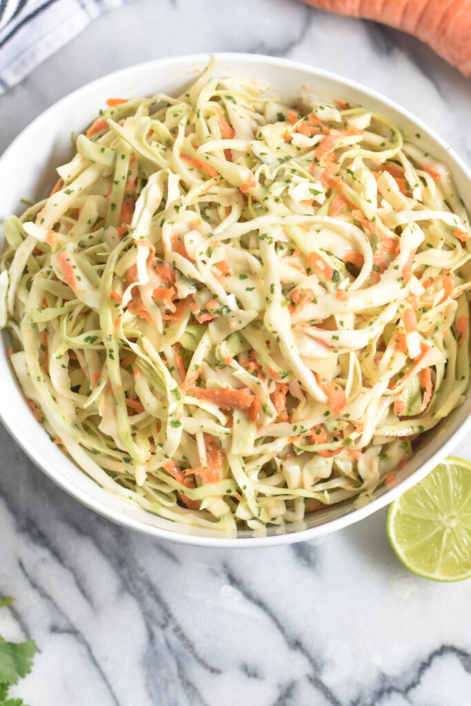 If you need a simple and easy side dish that is on the lighter side for your BBQs, this Cilantro Lime Slaw is a perfect addition to your table. This cilantro slaw makes a great topping too.