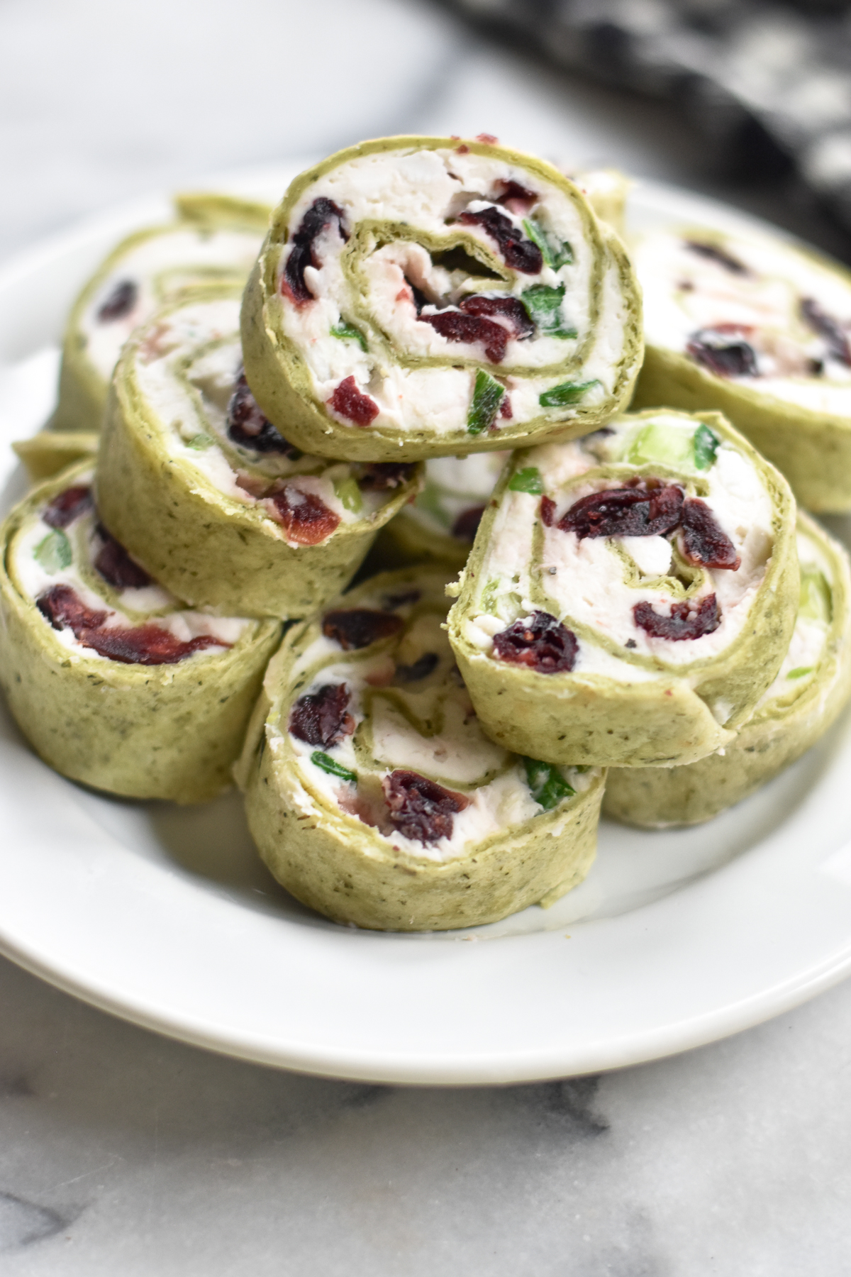 Vegan Cranberry and Feta Pinwheels are the perfect Christmas appetizer. These will be the hit of every party!